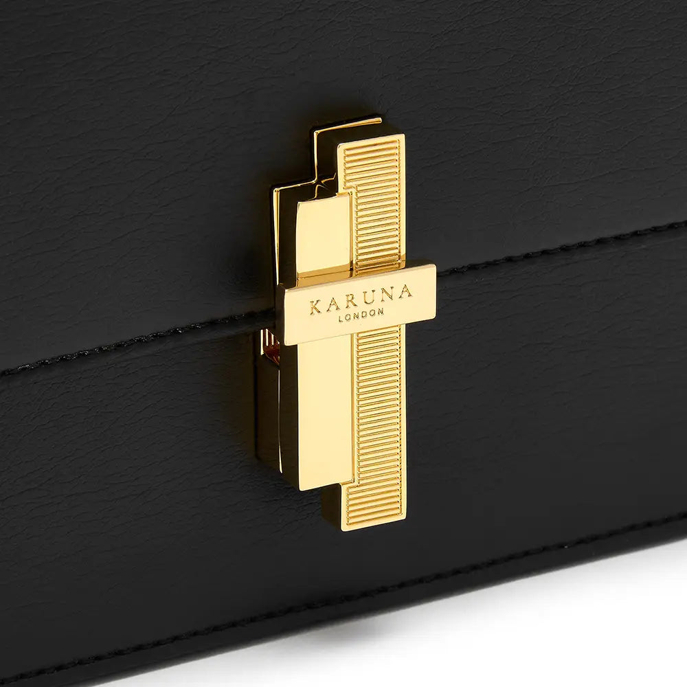Karuna London Melrose black cross body bag with branded lock